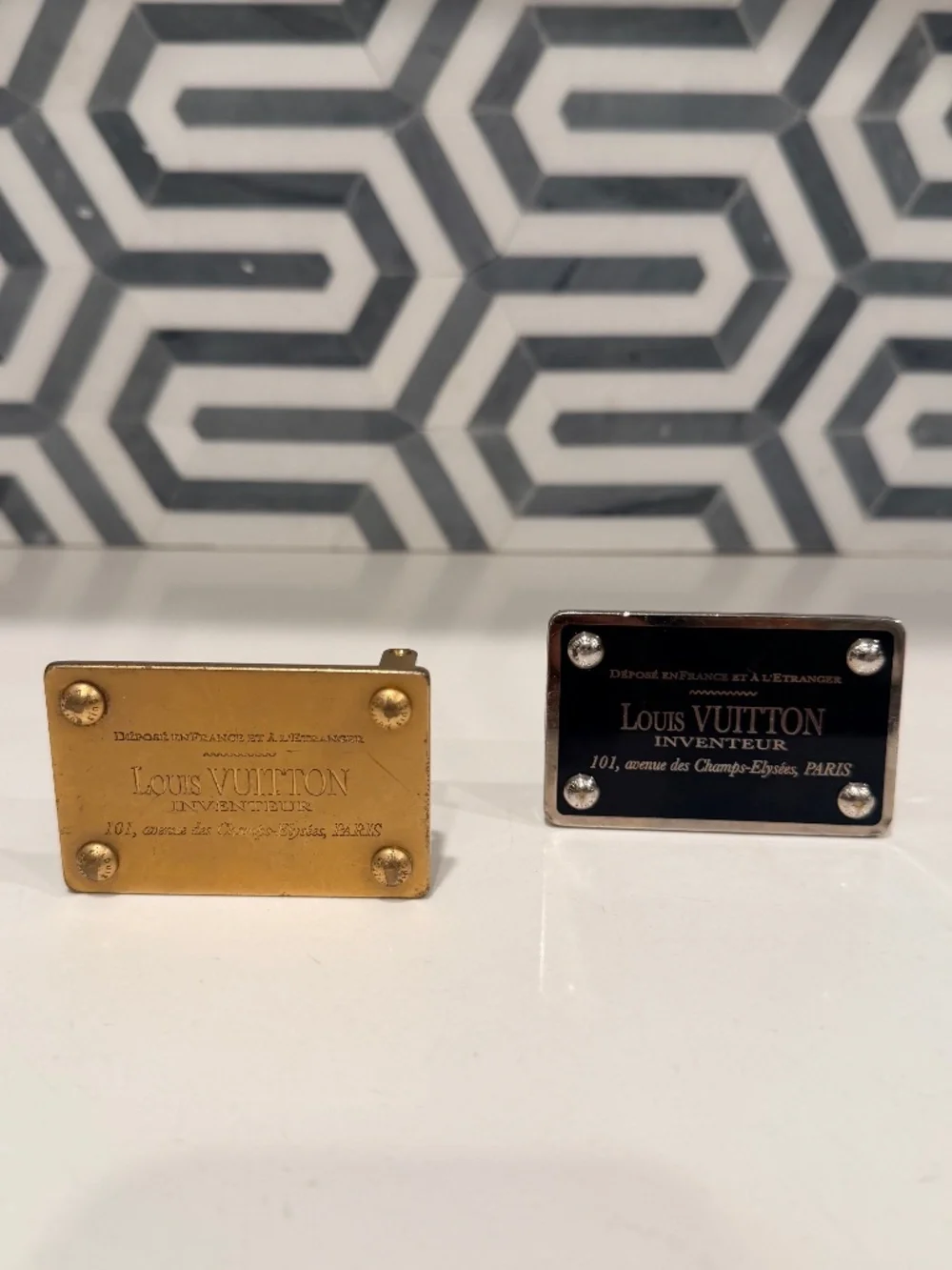 2 Luis Vuitton belt buckles